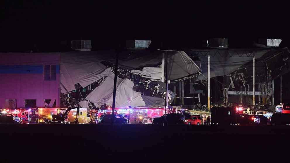 PHOTO: First responders surround a damaged Amazon Distribution Center on Dec. 10, 2021, in Edwardsville, Ill. According to reports, the Distribution Center was struck by a tornado Friday night.