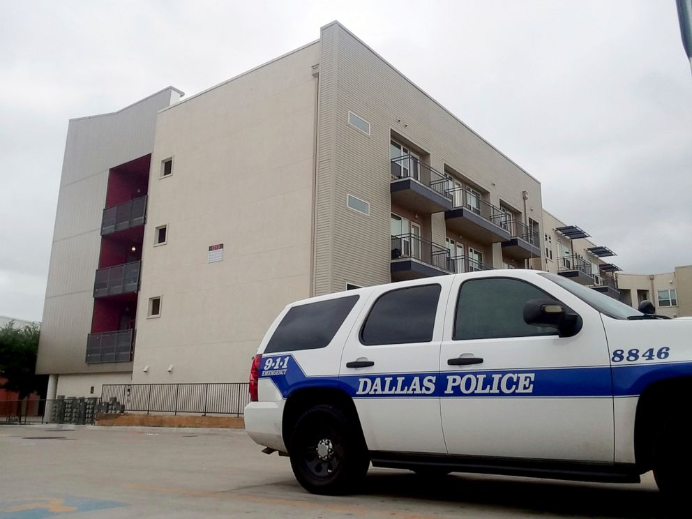 PHOTO: A Dallas Police vehicle is parked near the South Side Flats apartments, Sept. 10 2018, in Dallas. 