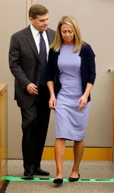 PHOTO: Fired Dallas police officer Amber Guyger is led off the witness stand by her attorney Toby Shook as shes about to put on her service vest as she testifies in her murder trial, Sept. 27, 2019, in Dallas.