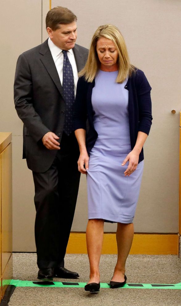 PHOTO: Fired Dallas police officer Amber Guyger is led off the witness stand by her attorney Toby Shook as she's about to put on her service vest as she testifies in her murder trial, Sept. 27, 2019, in Dallas.