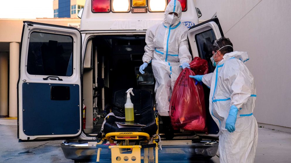 PHOTO: EMTs cleanse their materials outside Memorial West Hospital where coronavirus disease (COVID-19) patients are treated, in Pembroke Pines, Florida, July 13, 2020.