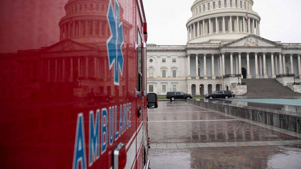 PHOTO: An ambulance sits outside the U.S. Capitol in Washington, D.C., on March 23, 2020, as the Senate continues negotiations on an economic relief package in response to the coronavirus pandemic.