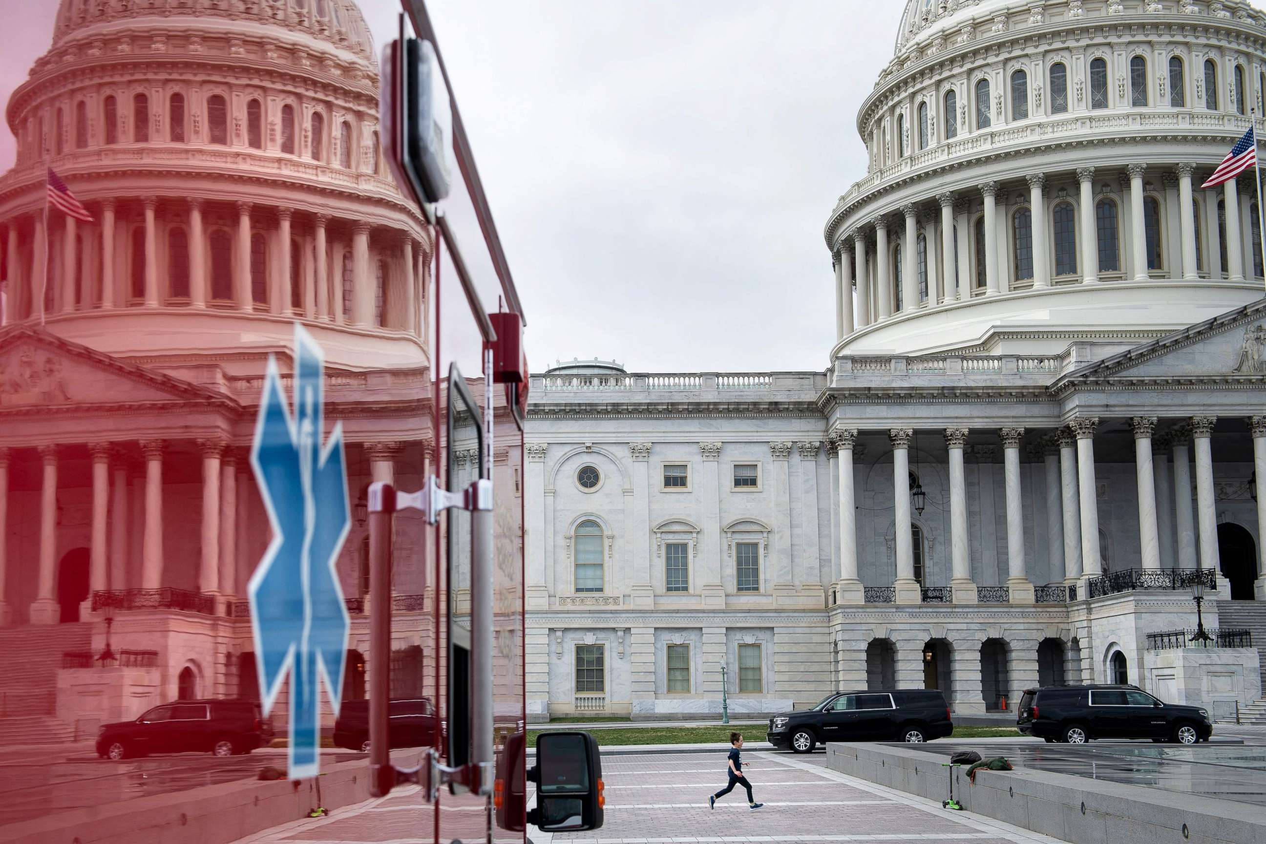 PHOTO: A view of the U.S. Capitol's Rotunda is seen reflected in an ambulance as negotiations on an economic stimulus package amid the coronavirus pandemic continue on Capitol Hill in Washington, D.C., on March 24, 2020.