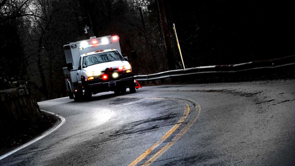 PHOTO: An ambulance with flashing lights alongside a road in this stock photo.