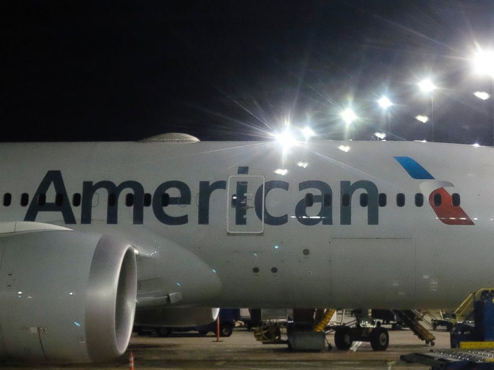 This Nov. 25, 2017 file photo shows an American Airlines plane parked at a gate.