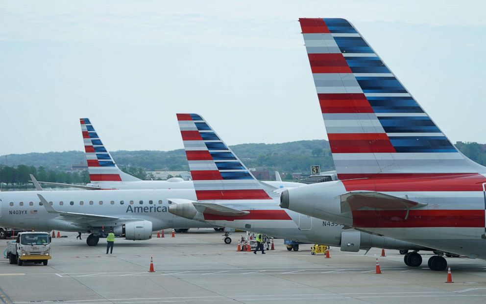 FILE PHOTO: FILE PHOTO: American Airlines jets sit at Reagan National Airport in Washington, U.S. April 29, 2020.