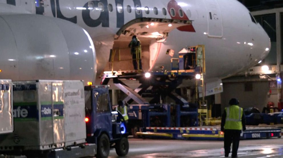 PHOTO: In this screen grab from a video, American Airline employees load a cargo plane with its first COVID-19 vaccine shipment.