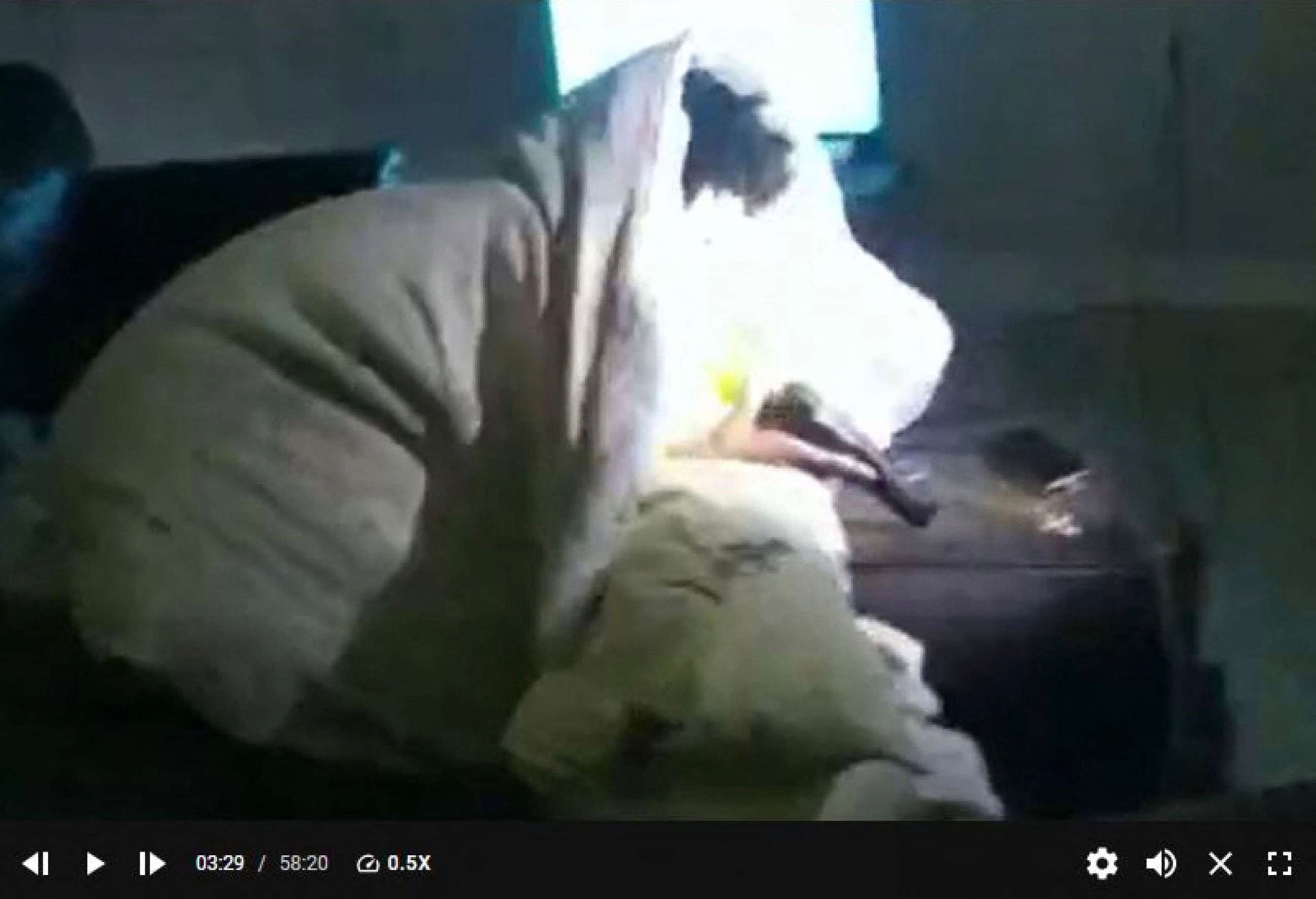 PHOTO: This screen grab taken from Minneapolis Police Department body camera footage and made available on Feb. 3, 2022, shows Amir Locke lying on a sofa under a blanket and holding a gun before being shot by police in Minneapolis.