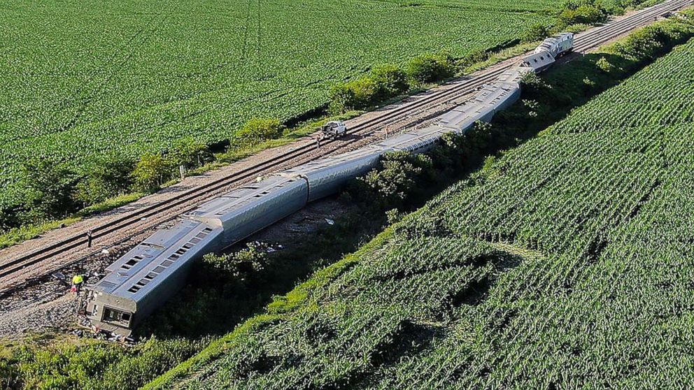 PHOTO: Several passenger cars and the engines of an Amtrak train rest on their sides after the train hit a truck at a crossing, June 28, 2022, near Mendon, Mo.