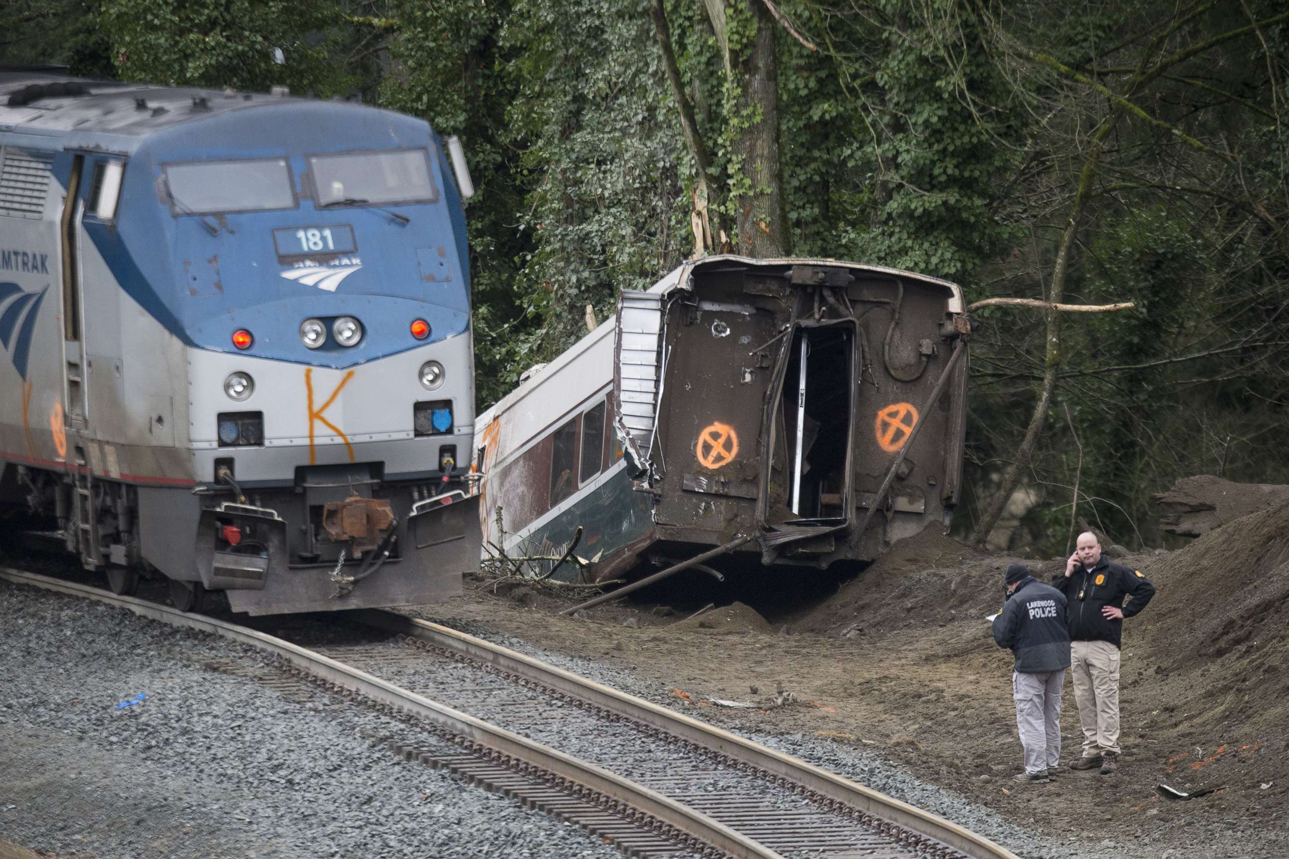 PHOTO: Investigators work at the scene of a Amtrak train derailment on Dec. 18, 2017 in DuPont, Wash.