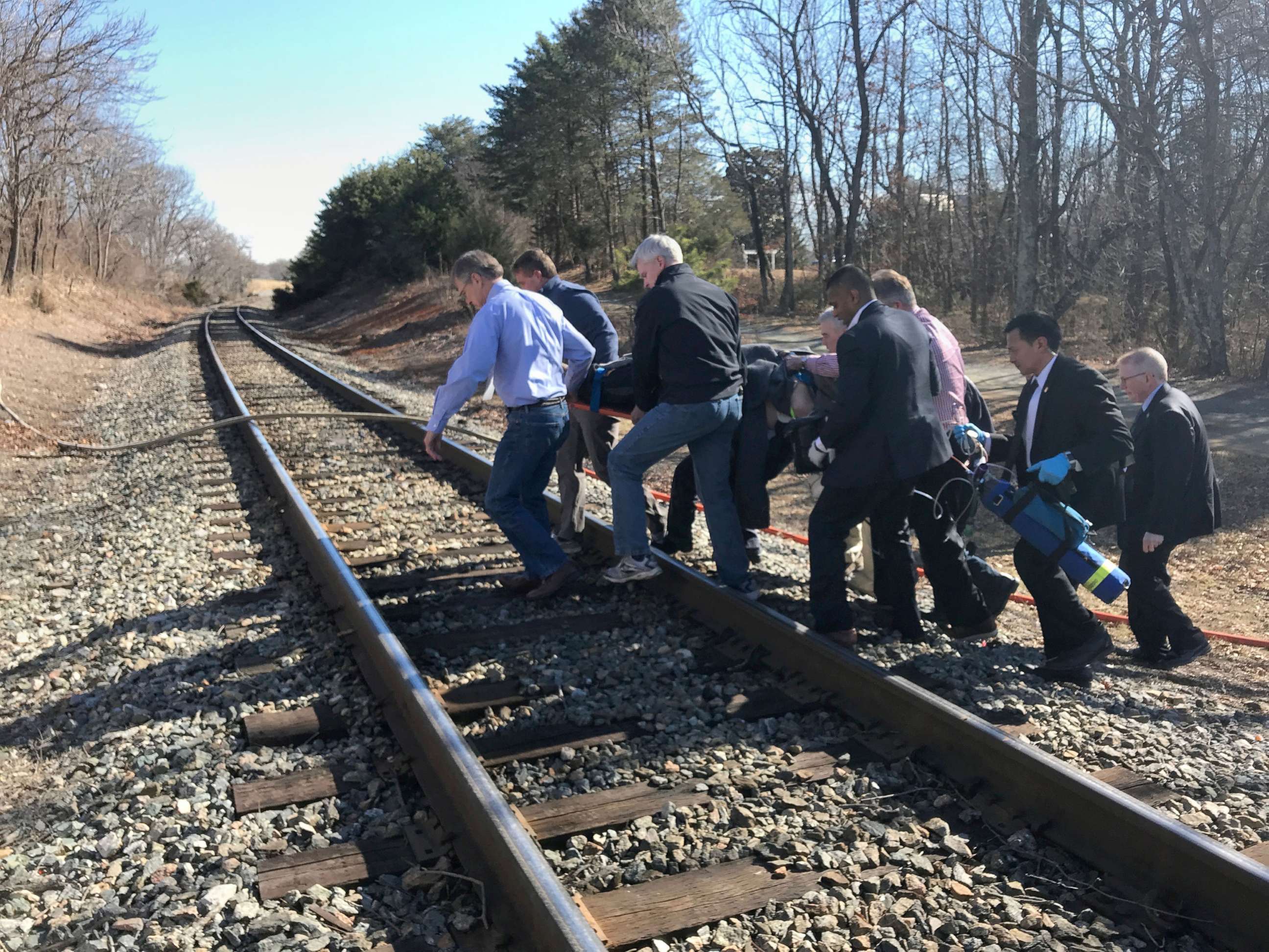 PHOTO: First responders and passengers from an Amtrak passenger train carrying  members of Congress, carry one of the injured to an ambulance after the train collided with a garbage truck in Crozet, Va., Jan. 31, 2018.