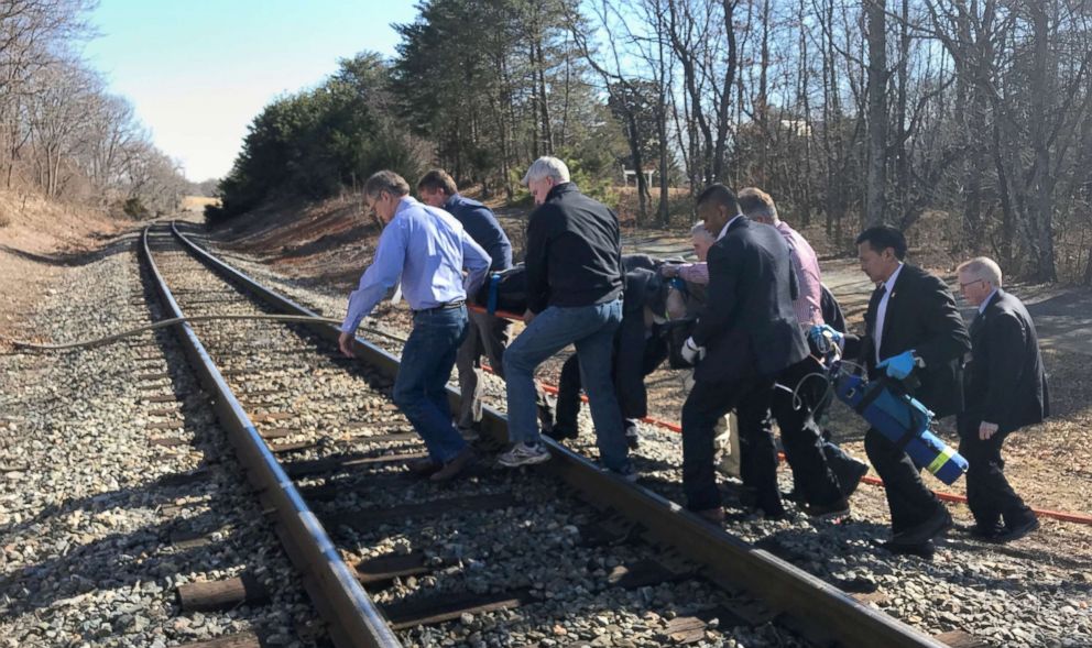 PHOTO: First responders and passengers from an Amtrak passenger train carrying members of Congress, carry one of the injured to an ambulance after the train collided with a garbage truck in Crozet, Va., Jan. 31, 2018.