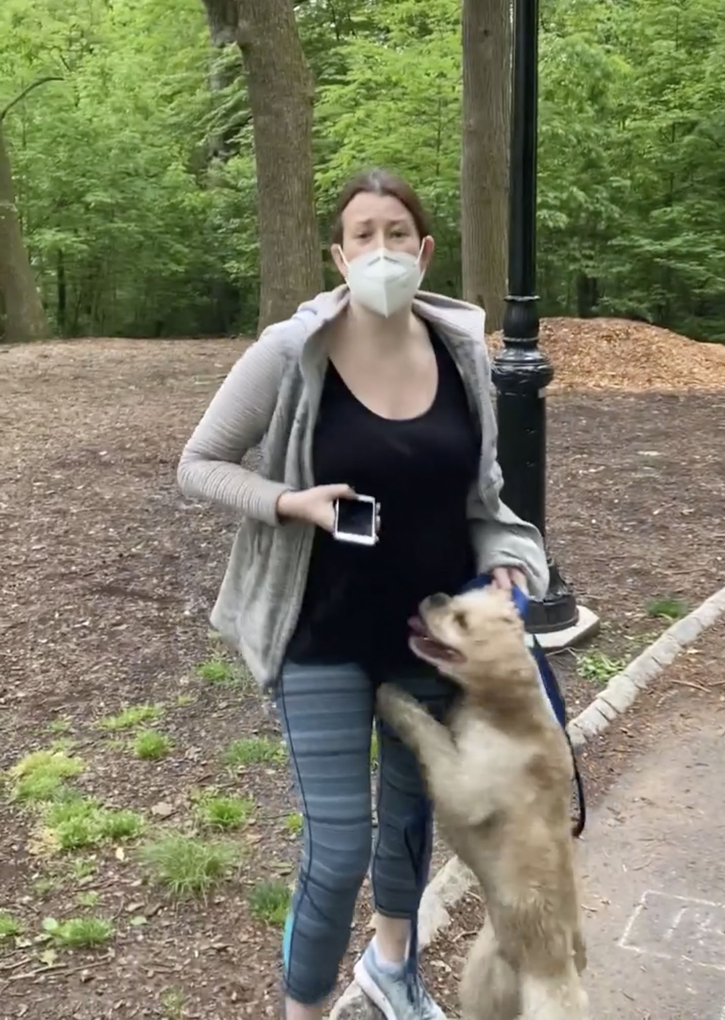 PHOTO: This image made from a May 25, 2020, video provided by Christian Cooper shows Amy Cooper with her dog talking to Christian Cooper at Central Park in New York.