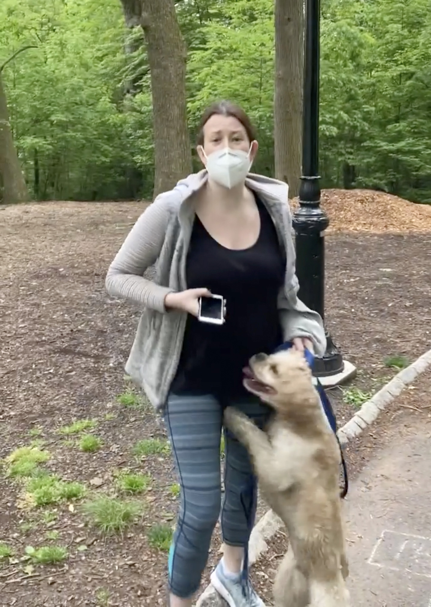 PHOTO: In this May 25, 2020 file photo, made from video provided by Christian Cooper, Amy Cooper talks with Christian Cooper in Central Park in New York.