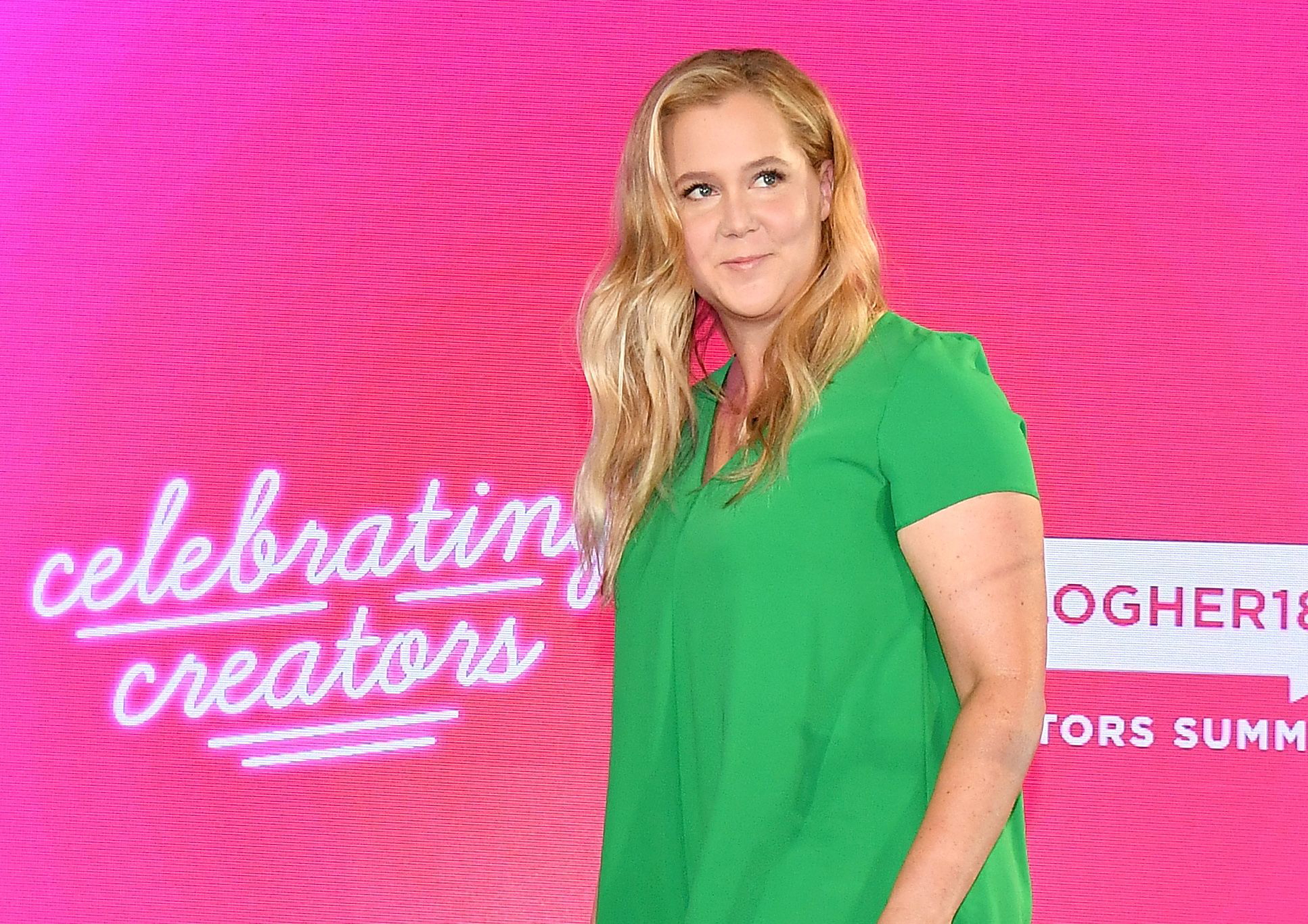 PHOTO: Amy Schumer walks onstage at the #BlogHer18 Creators Summit at Pier 17 on Aug. 8, 2018 in New York City.
