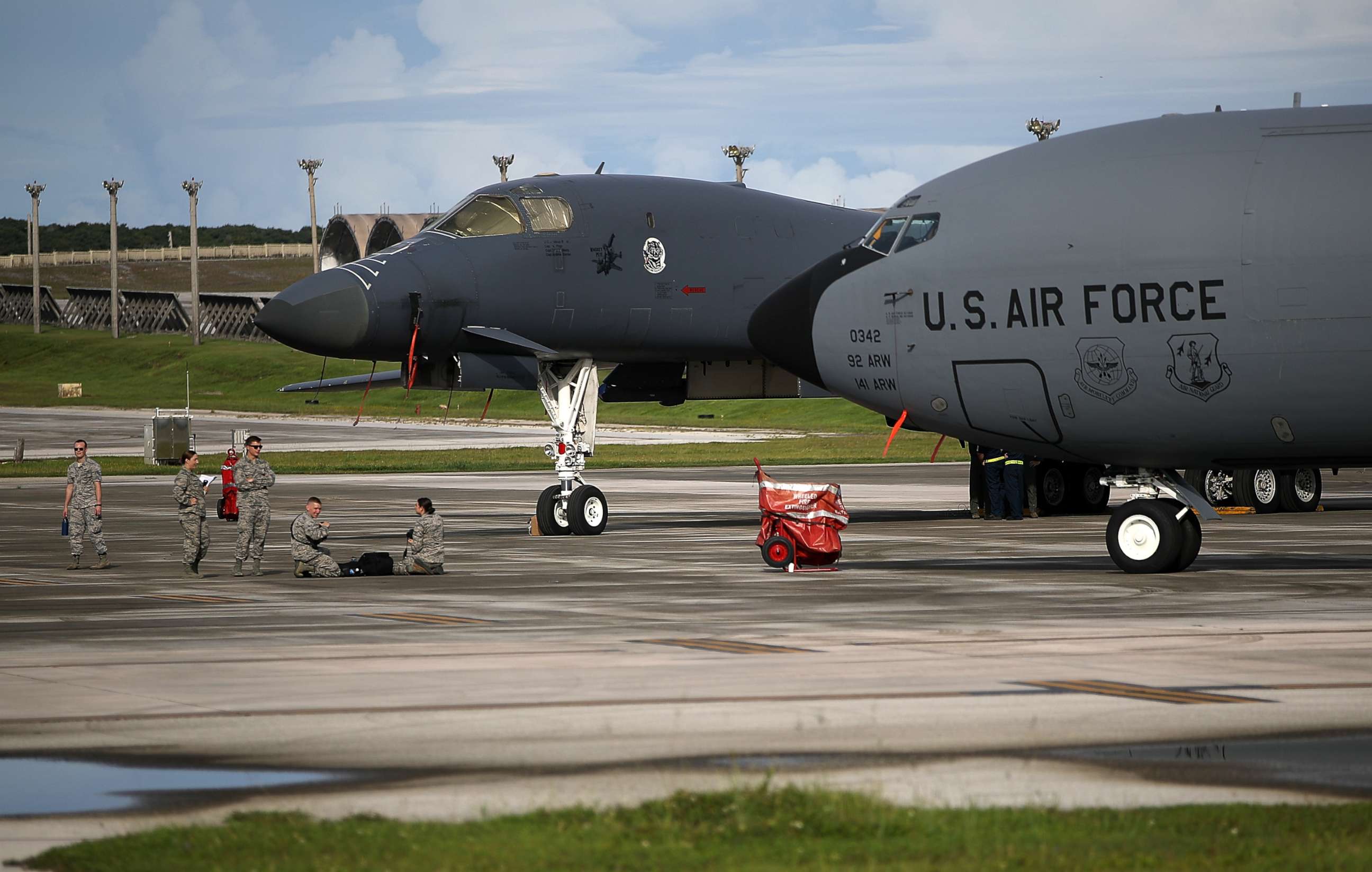 PHOTO: A U.S. Air Force Rockwell B-1B Lancer (L) and a Boeing KC-135 Stratotanker (R) sit on the tarmac at Andersen Air Force base, Aug. 17, 2017 in Yigo, Guam. 