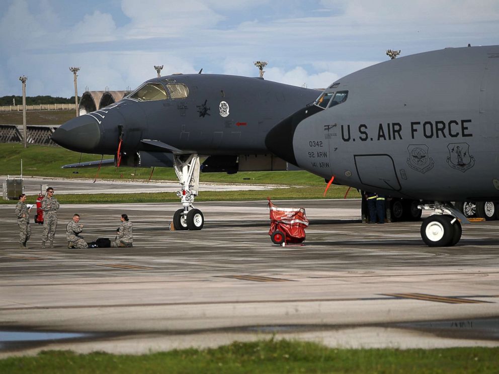 PHOTO: A U.S. Air Force Rockwell B-1B Lancer (L) and a Boeing KC-135 Stratotanker (R) sit on the tarmac at Andersen Air Force base, Aug. 17, 2017 in Yigo, Guam.