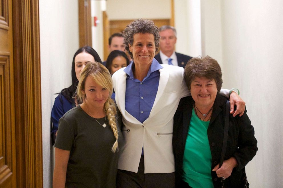 PHOTO: Bill Cosby accuser Andrea Constand reacts with lawyer Dolores Troiani, right, and Delaney Henderson, left, after the guilty verdict in Bill Cosby's trial at the Montgomery County Courthouse on April 26, 2018, in Norristown, Pa.