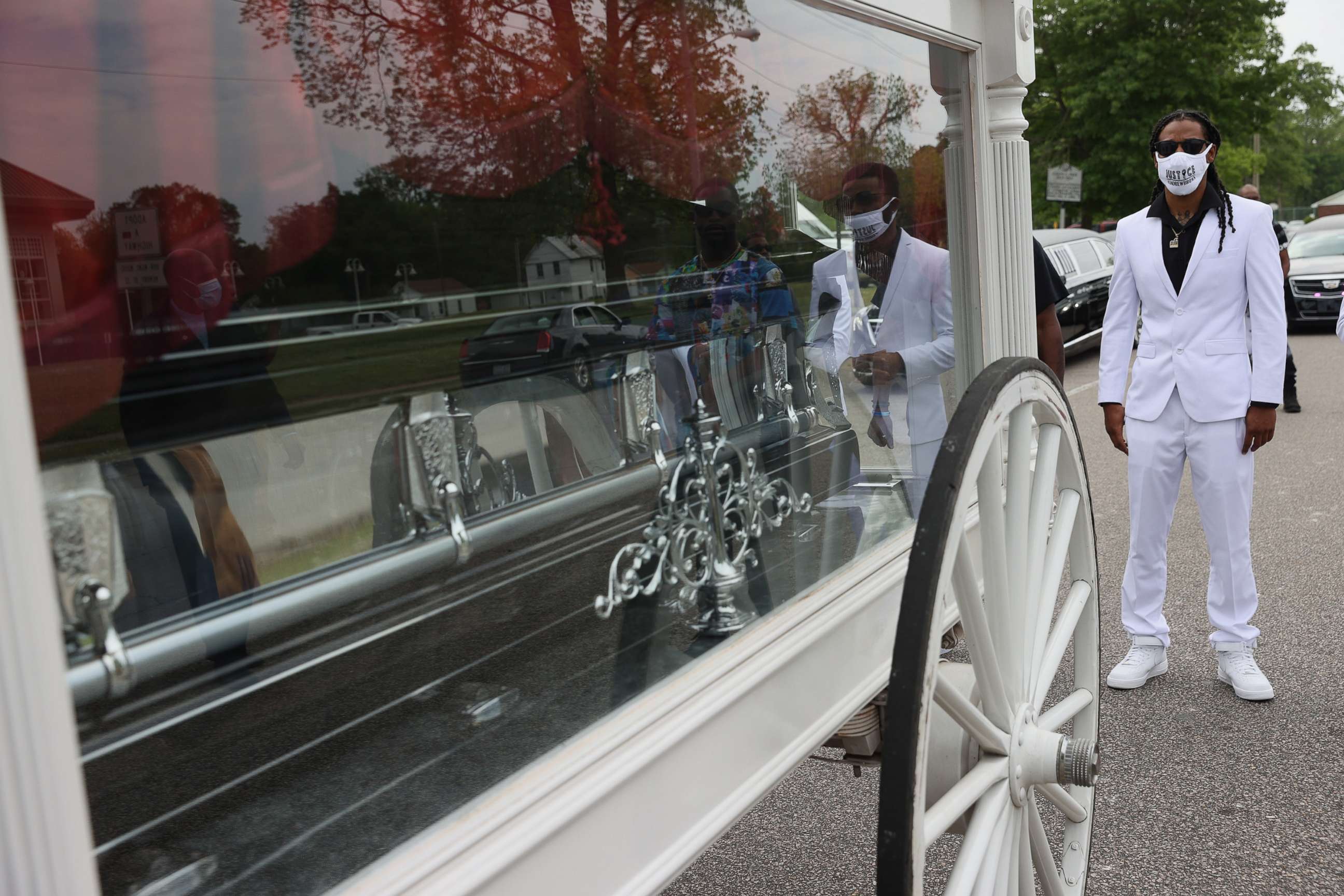 PHOTO: Khalil Ferebee follows behind a horse drawn carriage bringing the remains of his father Andrew Brown Jr. to his funeral service at the Fountain of Life church on May 03, 2021 in Elizabeth City, N.C.