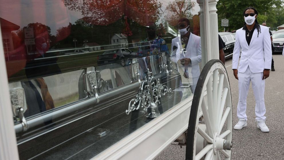 PHOTO: Khalil Ferebee follows behind a horse drawn carriage bringing the remains of his father Andrew Brown Jr. to his funeral service at the Fountain of Life church on May 03, 2021 in Elizabeth City, N.C.
