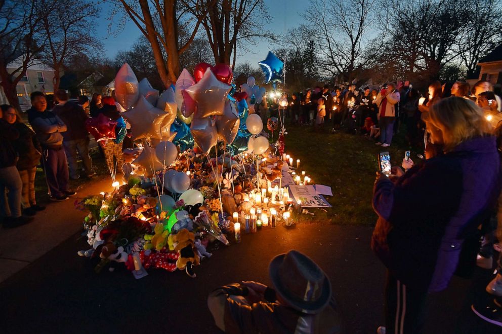 PHOTO: In this Wednesday, April 24, 2019 photo, community members in Crystal lake, Ill. hold a vigil in memory of 5-year-old Andrew AJ Freund.