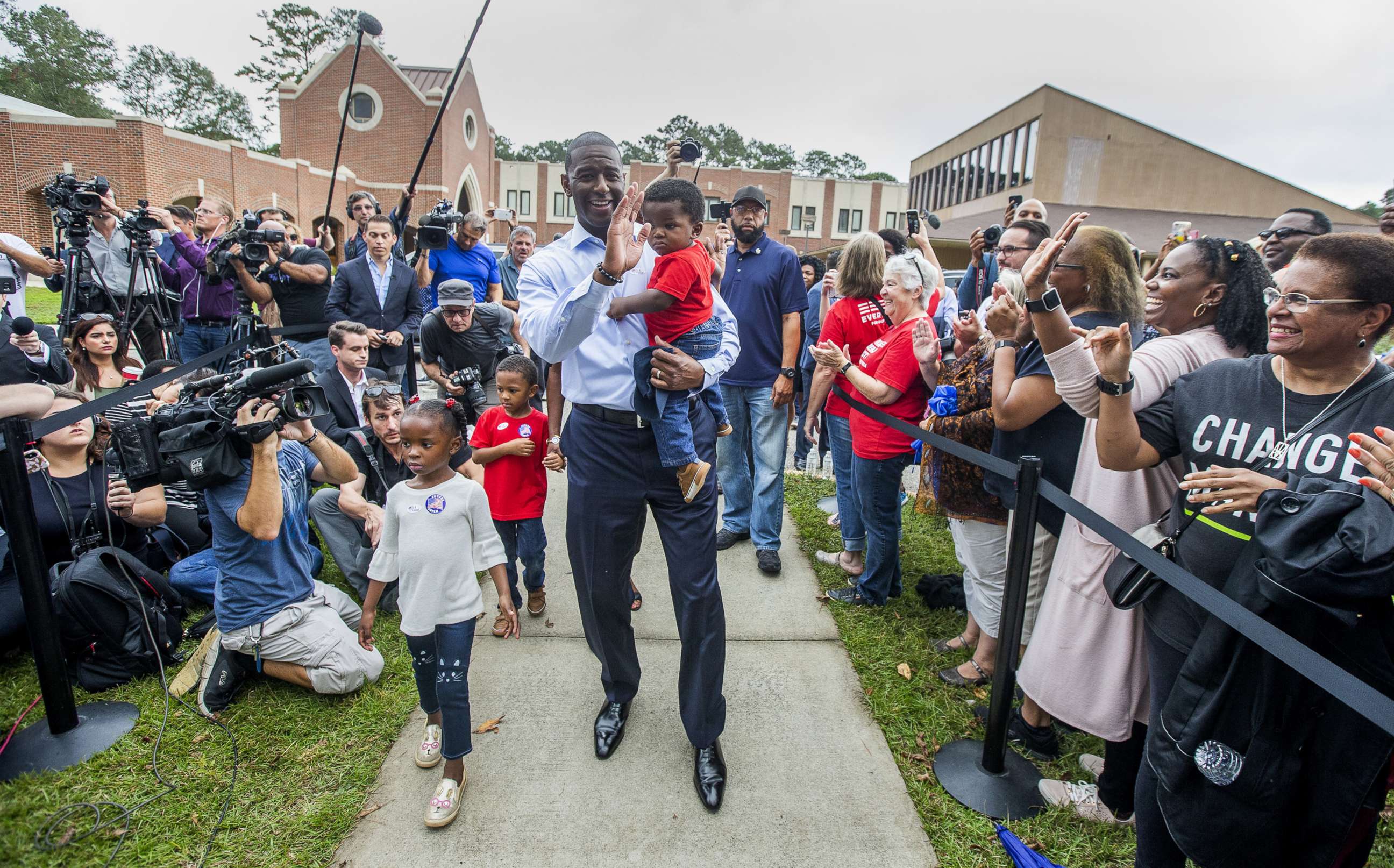 PHOTO: Tallahassee mayor and Florida Democratic gubernatorial candidate Andrew Gillum waves at supporters after casting his ballot with his children on Nov. 6, 2018 in Tallahassee, Fla.