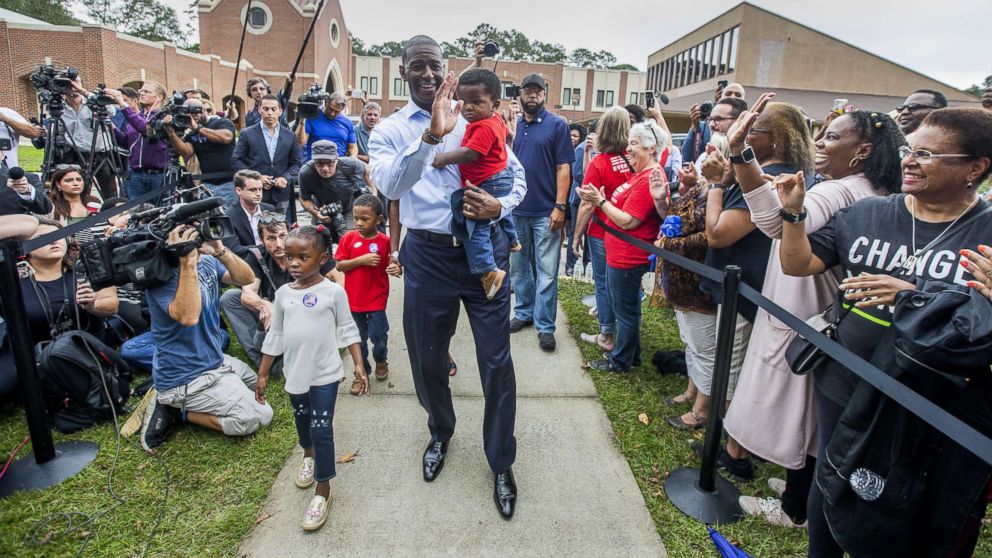 PHOTO: Tallahassee mayor and Florida Democratic gubernatorial candidate Andrew Gillum waves at supporters after casting his ballot with his children on Nov. 6, 2018 in Tallahassee, Fla.