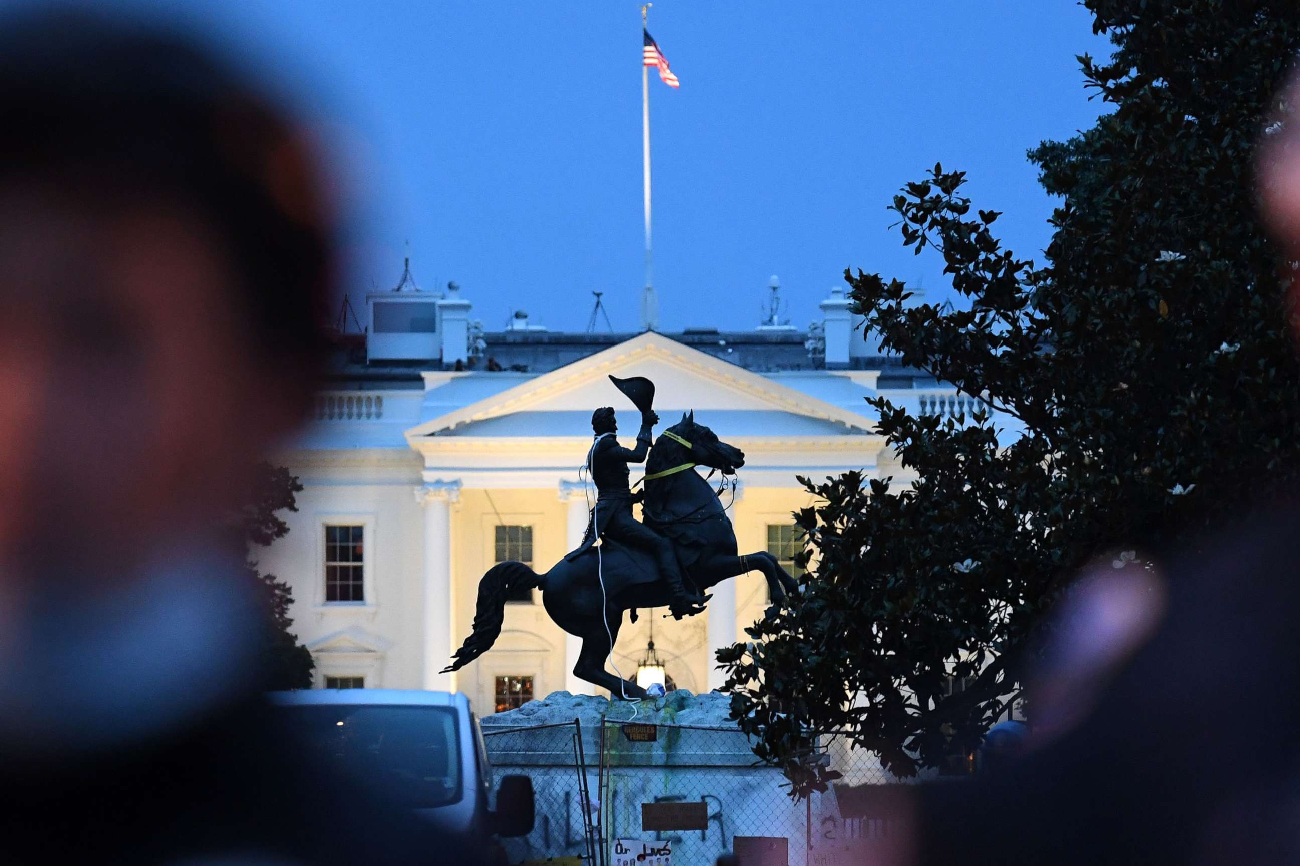 PHOTO: A row of police officers stand guard with the equestrian statue of former U.S. President Andrew Jackson behind, after protesters tried to topple it, at Lafayette Square, in front of the White House, June 22, 2020.