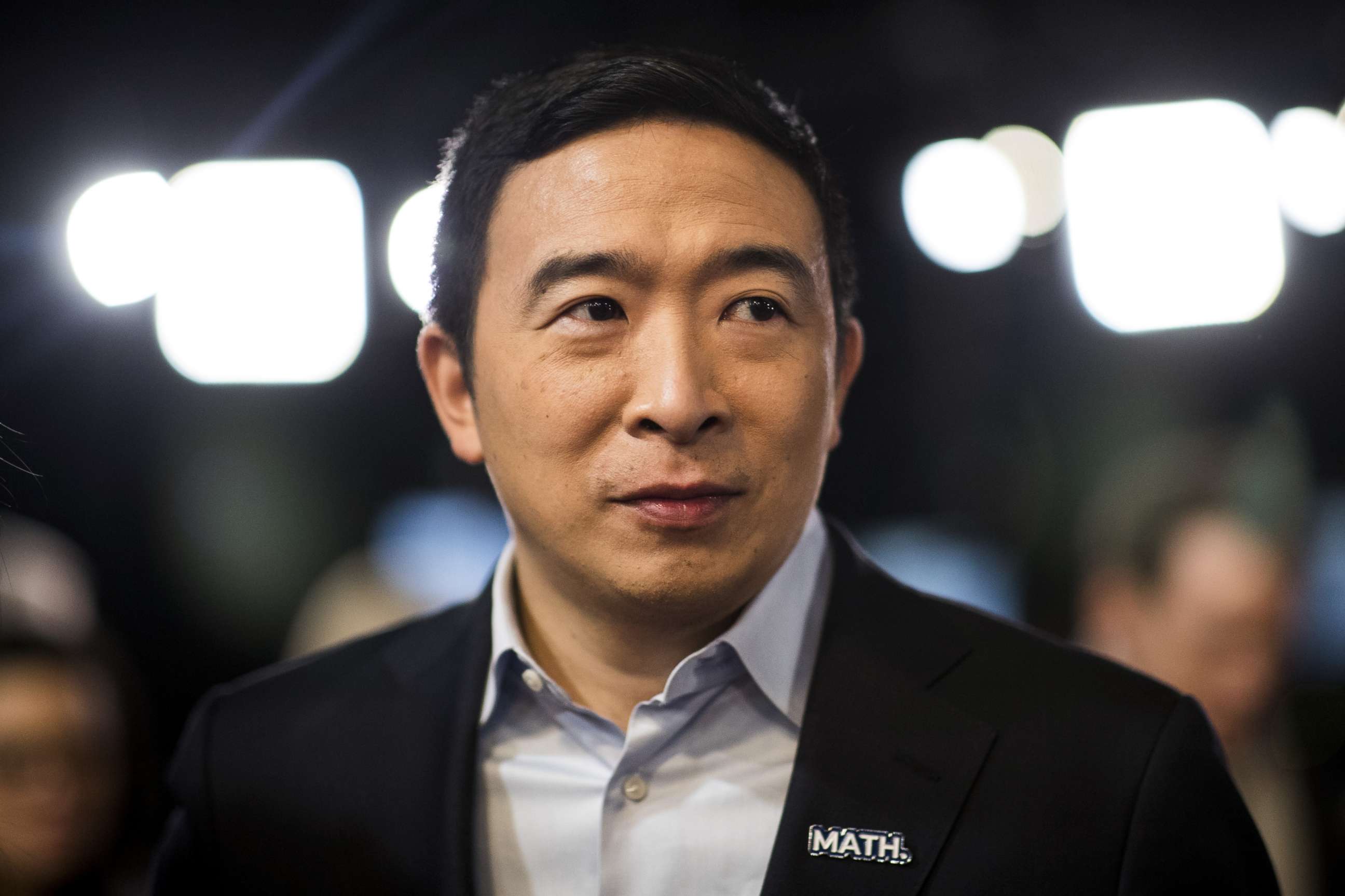 PHOTO: Andrew Yang stands in the spin room following the Democratic presidential debate at Saint Anselm College in Manchester, N.H., Feb. 7, 2020.
