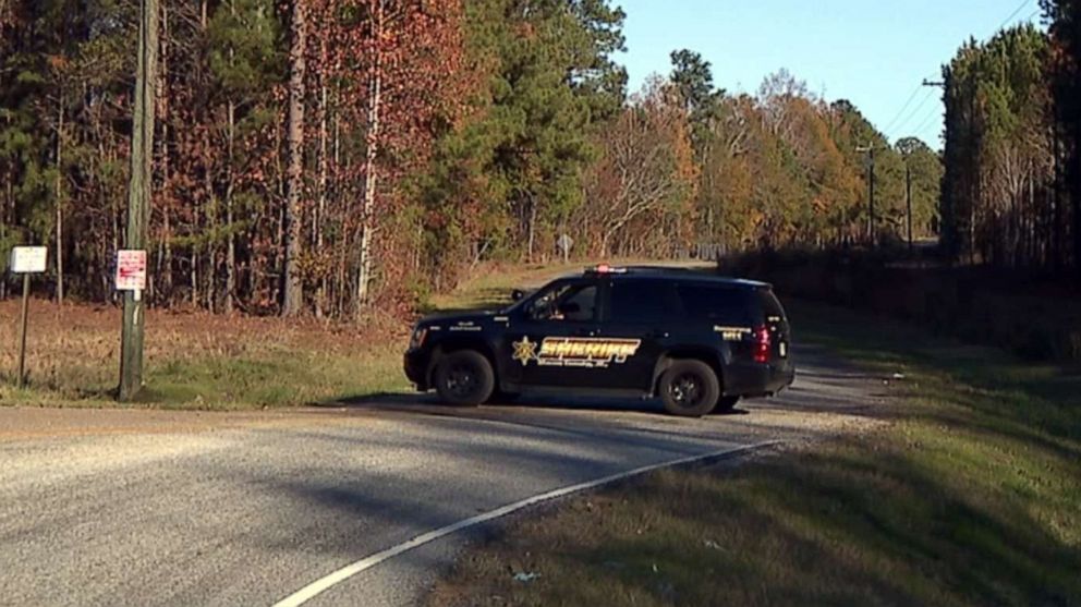 PHOTO: A Macon County, Ala., sheriff's vehicle sits near the site where human remains were found on Nov. 25, 2019.