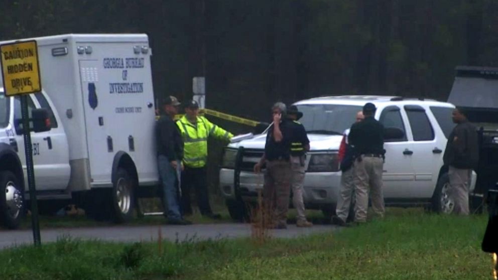 PHOTO: Investigators gather near where the body of Anitra Gunn was found in Crawford County, Ga., Feb. 18, 2020.