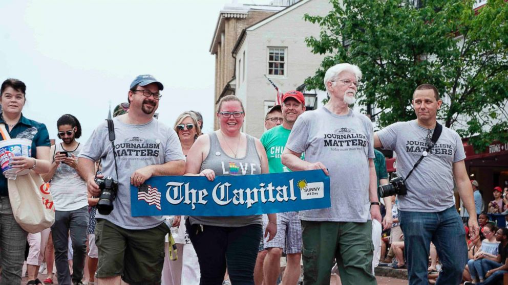 PHOTO: Current and former Capital Gazette staff members march in the Annapolis 4th of July parade in Annapolis, Md., July 4, 2018.