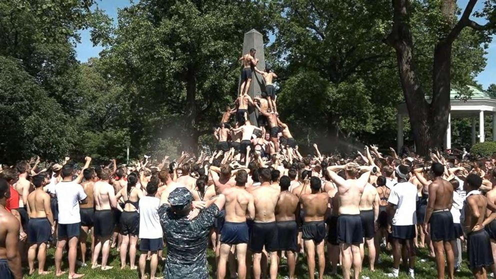 PHOTO: Freshmen at the U.S. Naval Academy in Annapolis, Md., attempt to climb a greased monument to place a hat at the top in an annual tradition that promotes the class from "plebes" to "fourth class midshipmen," May 21, 2018.