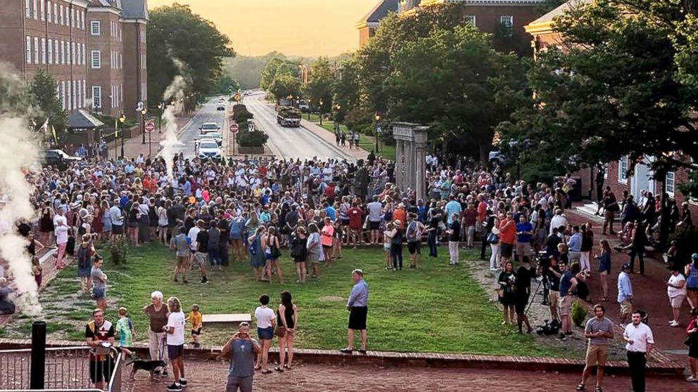Hundreds of people attended a walking vigil in Annapolis, Md., to mourn the death of five employees of the Capital Gazette who were killed on Thursday during a shooting in the newsroom.