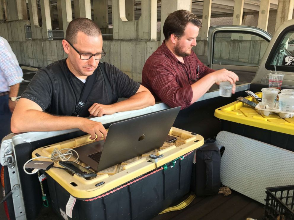 PHOTO: Capital Gazette reporter Chase Cook and photographer Joshua McKerrow work on the next day's newspaper while awaiting news from their colleagues in Annapolis, Maryland, June 28, 2018.