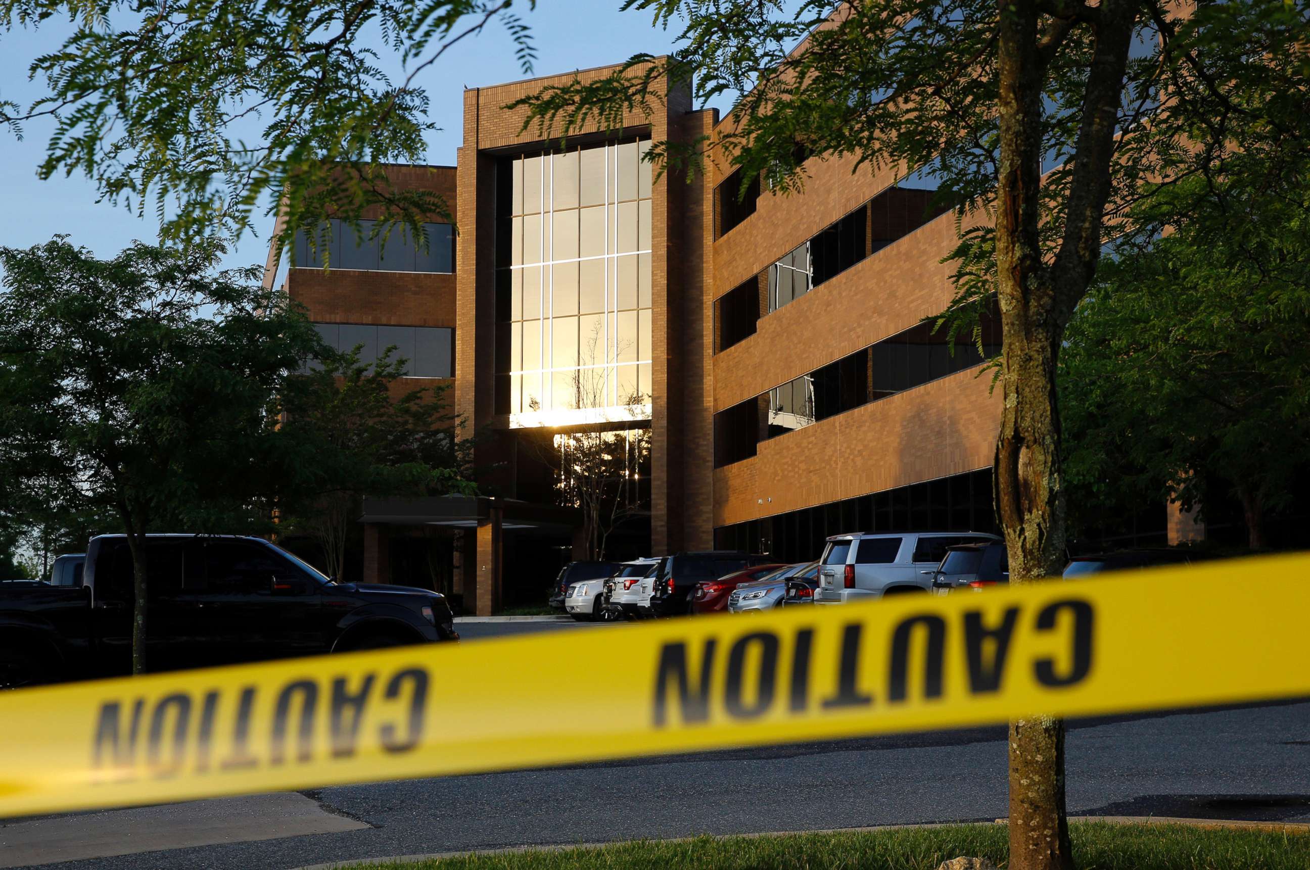 PHOTO: Crime scene tape surrounds a building housing The Capital Gazette newspaper's offices, June 29, 2018, in Annapolis, Md.