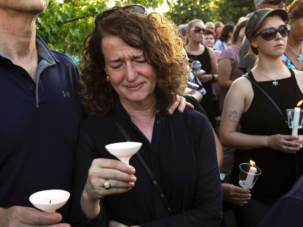 PHOTO: People gather for a candlelight vigil across the street from where five journalists were slain in their newsroom in Annapolis, Md., on June 29, 2018.