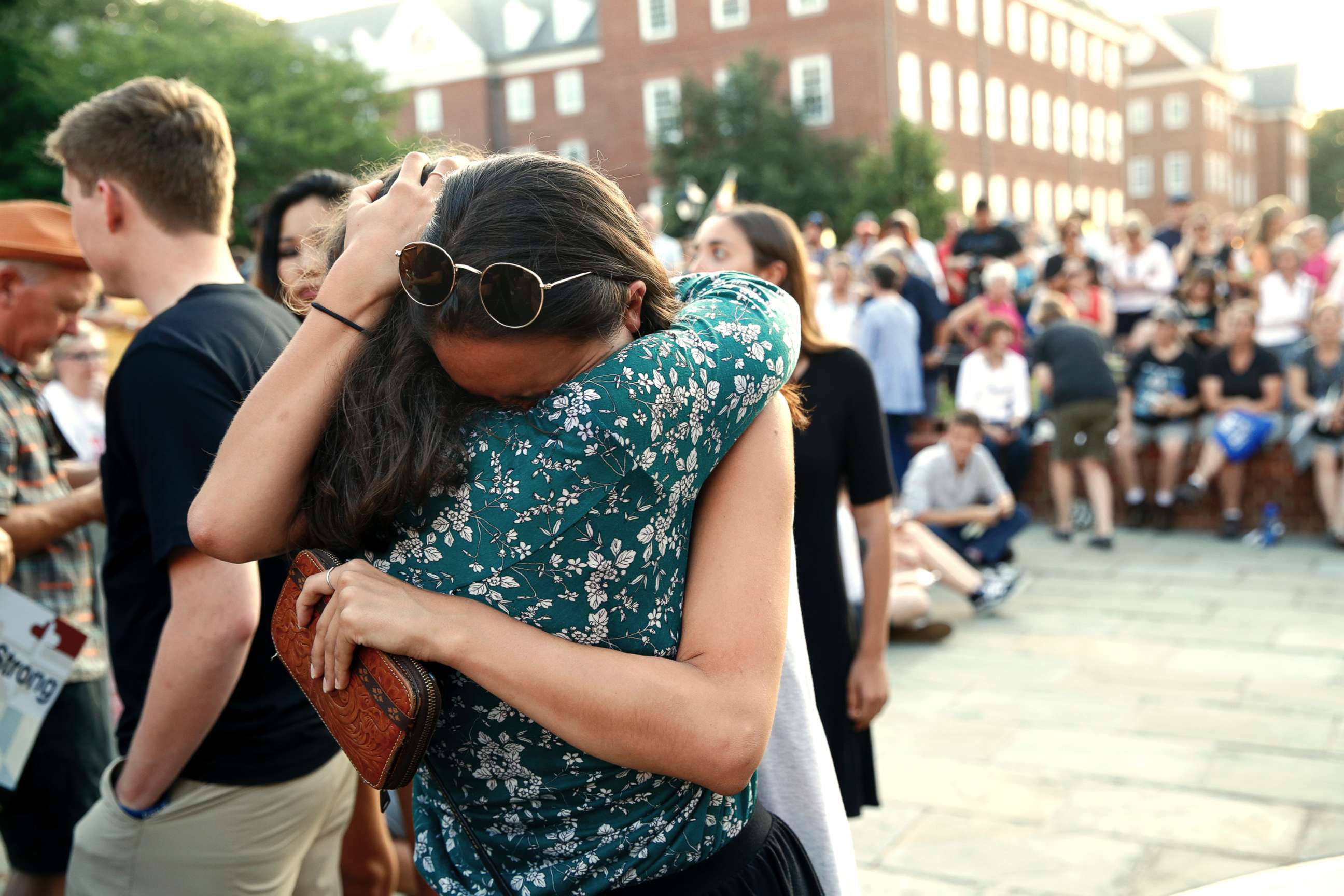 PHOTO: People hug as they gather for a vigil in response to a shooting in the Capital Gazette newsroom on June 29, 2018, in Annapolis, Md.