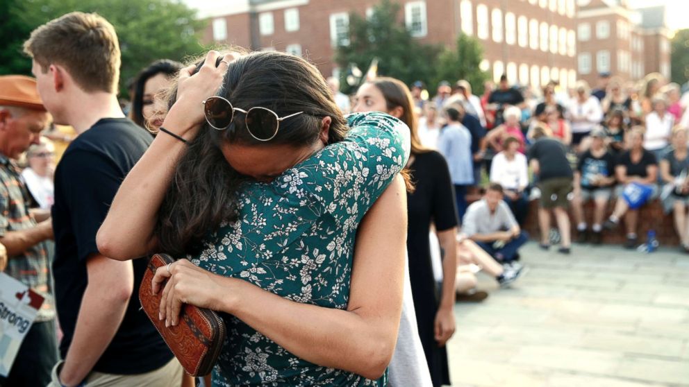 People hug as they gather for a vigil in response to a shooting in the Capital Gazette newsroom on June 29, 2018, in Annapolis, Md.