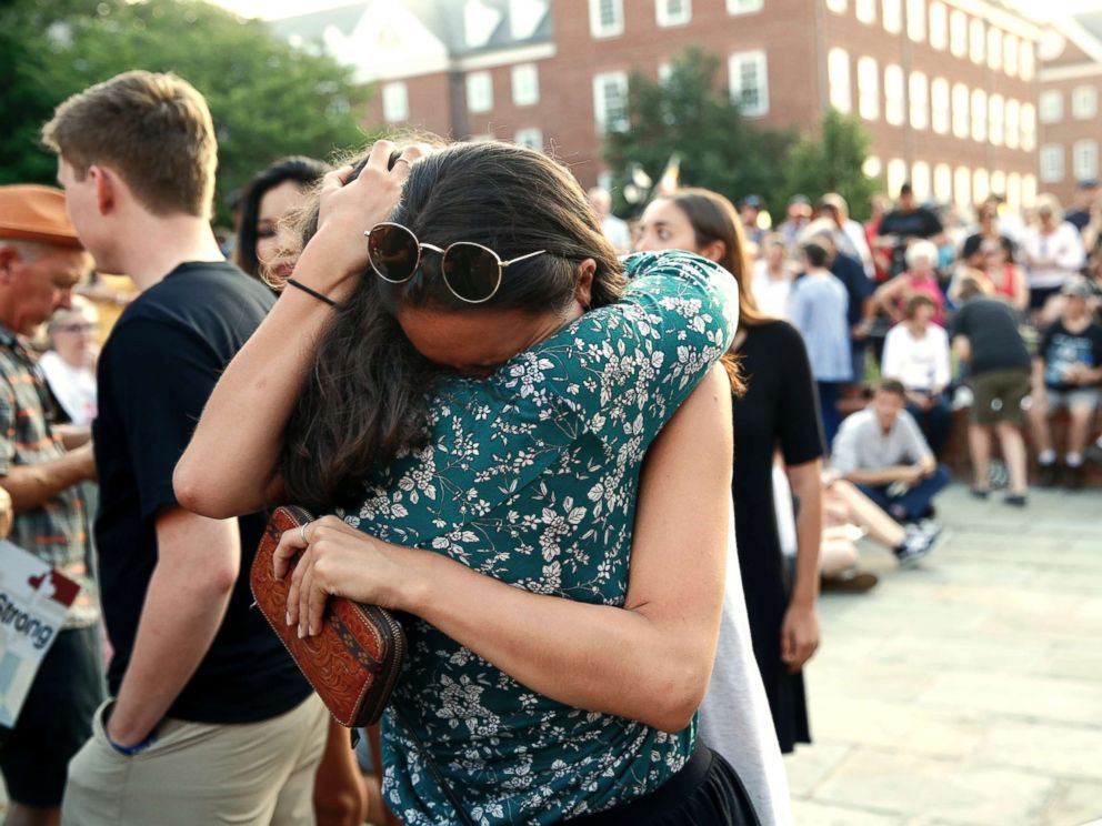 PHOTO: People hug as they gather for a vigil in response to a shooting in the Capital Gazette newsroom on June 29, 2018, in Annapolis, Md.