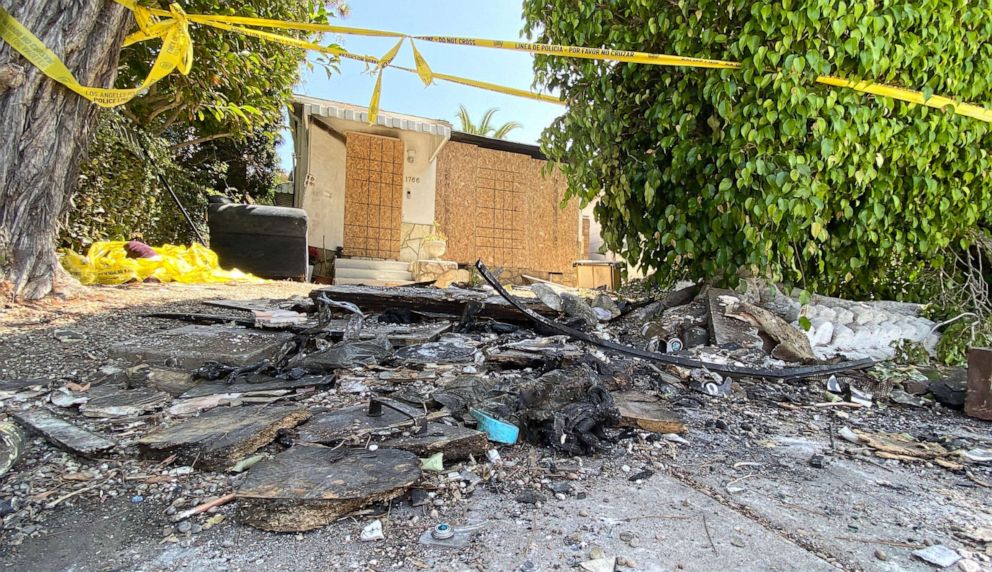 PHOTO: Charred debris and caution tape are seen at the site where actress Anne Heche crashed into a home in Mar Vista, Calif., Aug. 8, 2022. 