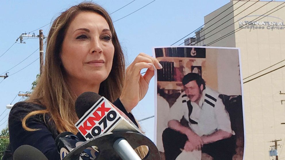 PHOTO: Attorney Annee Della Donna holds a photo of William Evins, now deceased, who was convicted of the murder of a woman in 1979, outside Superior Court in Santa Ana, July 25, 2018.