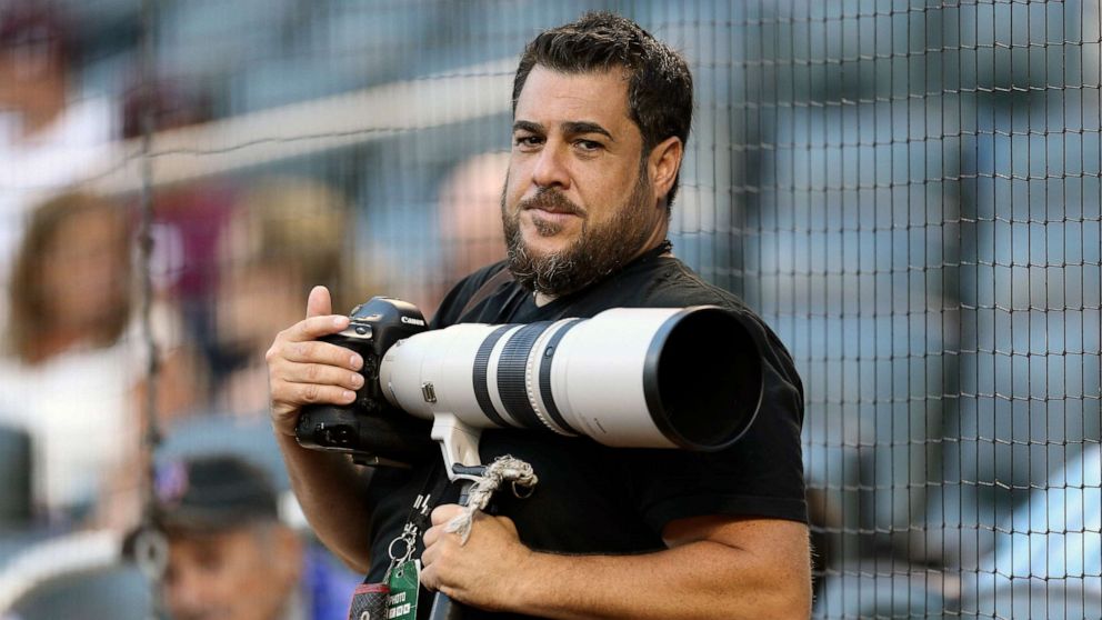 PHOTO: In this Aug. 2, 2016, photo provided by Christopher Pasatieri, New York Post photographer Anthony J. Causi is shown before a New York Mets baseball game in New York. Causi died Sunday, April 12, 2020, from the new coronavirus. He was 48.