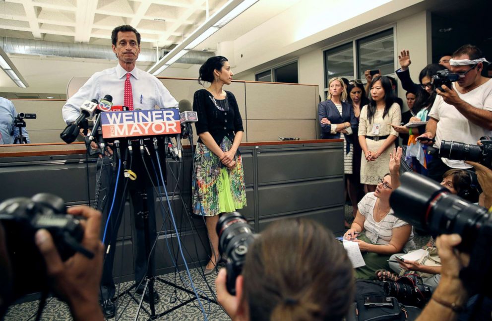 PHOTO: Anthony Weiner stands with his wife Huma Abedin during a press conference, July 23, 2013, in New York City.
