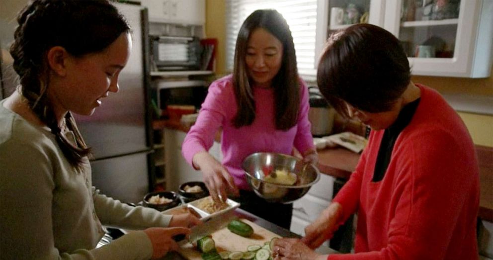 PHOTO: Activist Mina Fedor prepares a meal with her mother, Ivana Lee, and grandmother Min H. Lee during a visit with Good Morning America, May 27, 2022. 