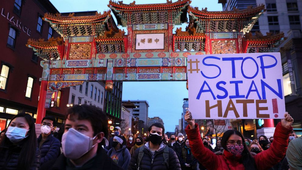 PHOTO: Activists participate in a vigil in response to the Atlanta spa shootings in which eight people were killed, March 17, 2021, in the Chinatown area of Washington, D.C.