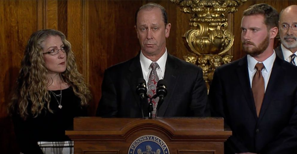 PHOTO: Tim Piazza's father, Piazza Piazza, speaks to Pennsylvania Governor Tom Wolf, who signs an anti-marvel law on October 19, 2018.