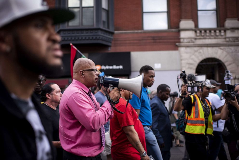 PHOTO: Activist Tio Hardiman speaks into a megaphone during an anti-violence march in Chicago, Aug. 2, 2018. The protest's goal was to bring attention to the city's rising gun violence issues.