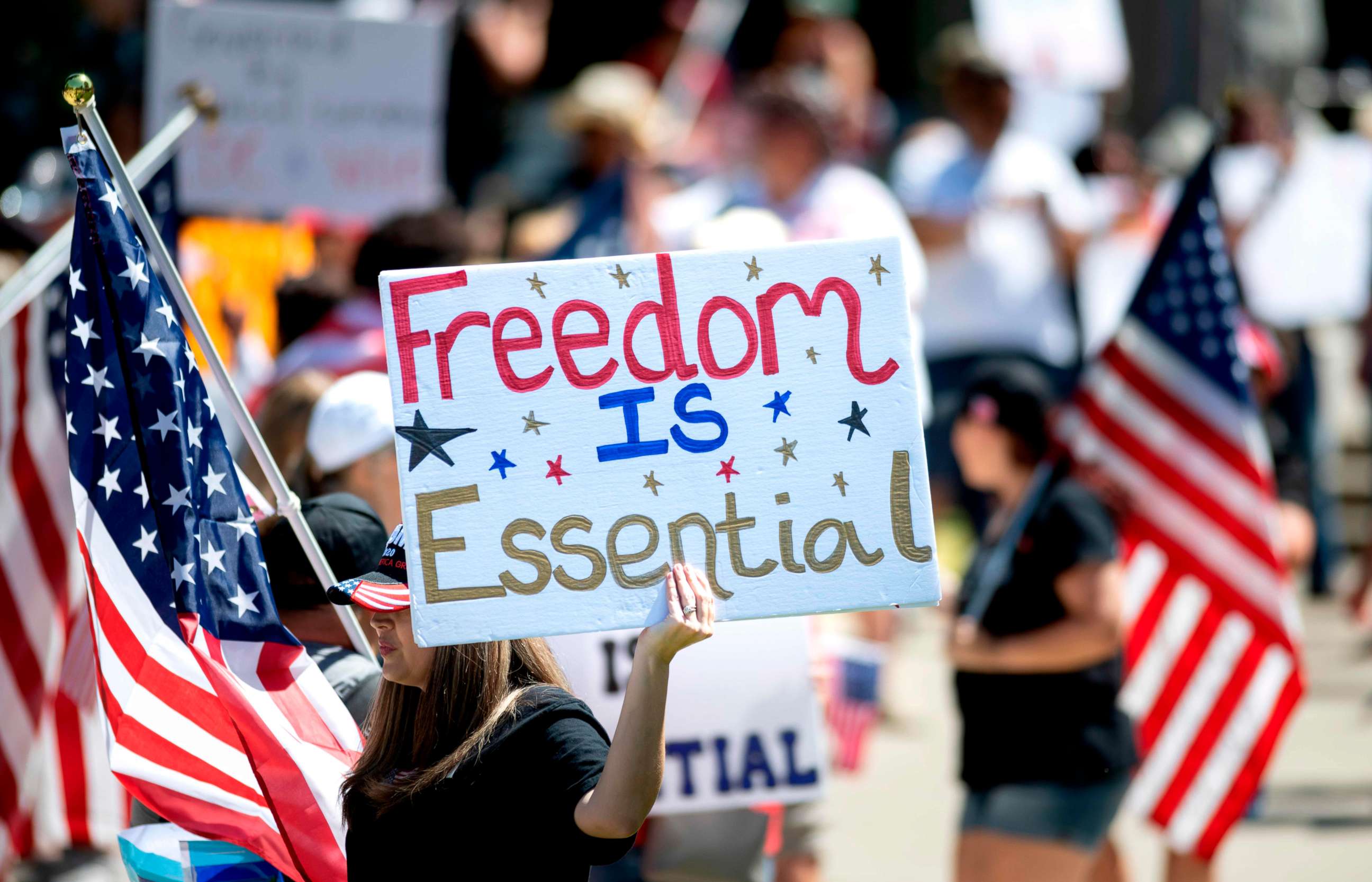 PHOTO: Hundreds of people gather to protest the stay-at-home orders outside the state capitol building in Sacramento, California, on May 1, 2020.