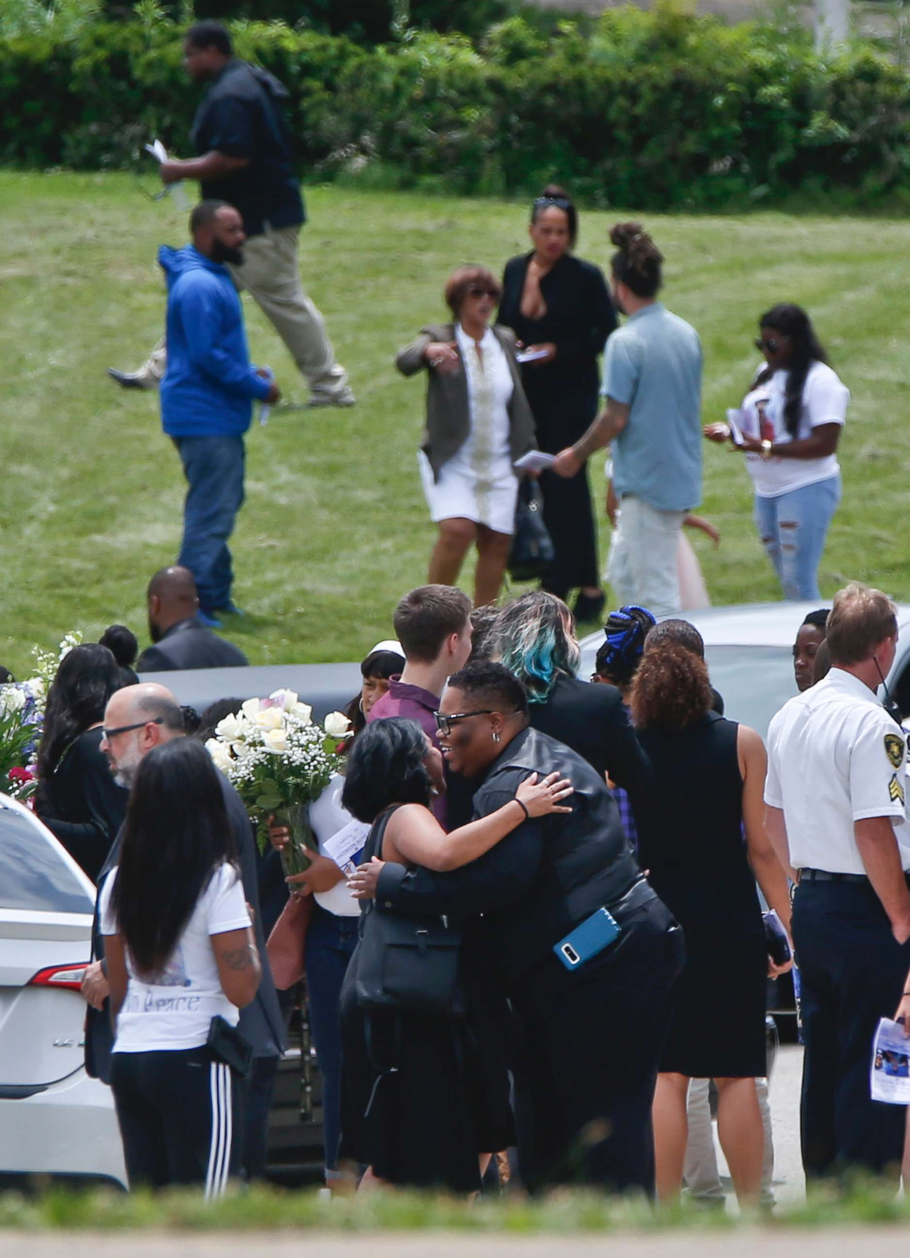 PHOTO: Mourners gather and embrace as they leave the funeral for Antwon Rose Jr., June 25, 2018, in Swissvale, Pa.